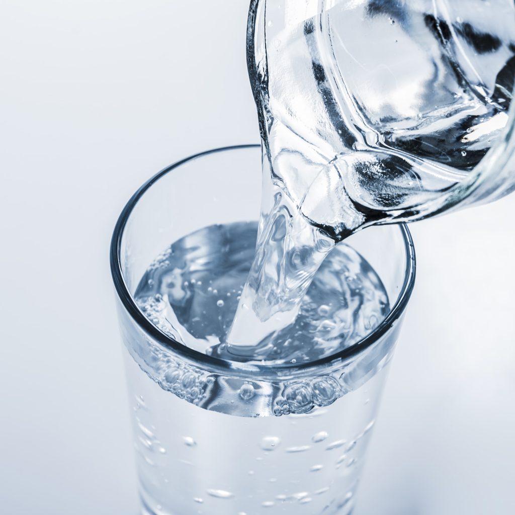 Top View Jar Filling Glass Water Min