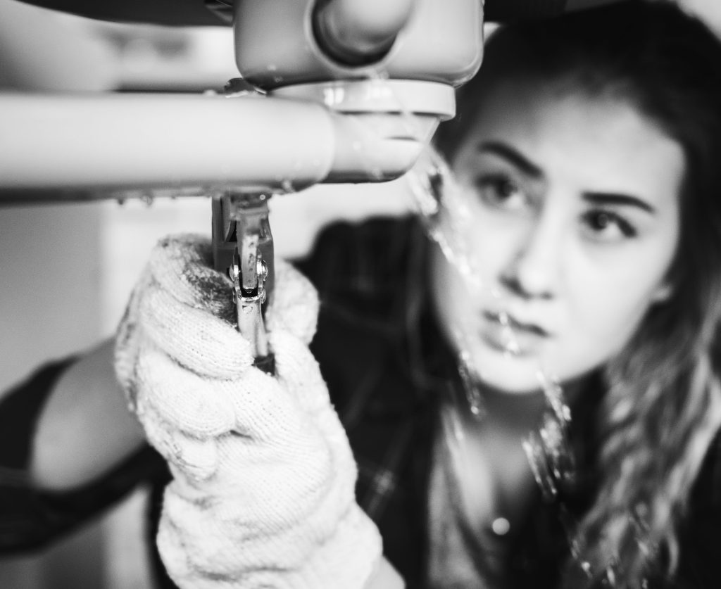 Woman Fixing Kitchen Sink Min